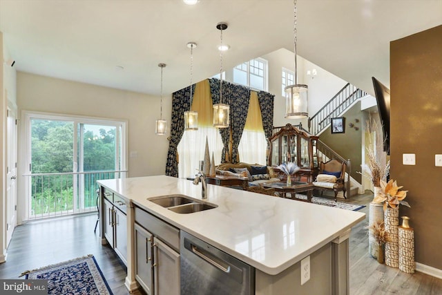 18010 Dave Anne Cir, Stewartstown, PA 17363 - kitchen with dishwasher, a sink, wood finished floors, open floor plan, and a kitchen island with sink