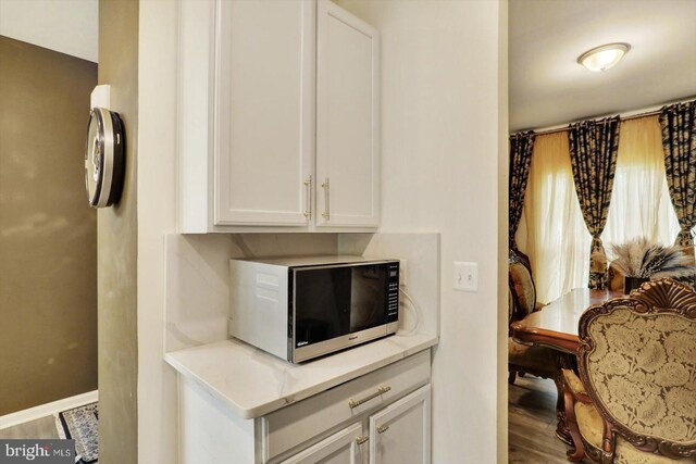 18010 Dave Anne Cir, Stewartstown, PA 17363 - kitchen view of white cabinetry, light countertops, and baseboards