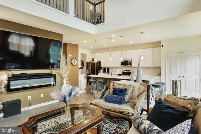 18010 Dave Anne Cir, Stewartstown, PA 17363 - living area with light wood-style flooring, recessed lighting, and baseboards