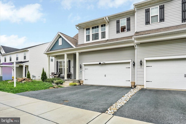 18010 Dave Anne Cir, Stewartstown, PA 17363 - view of front of home featuring a garage, covered porch, and driveway