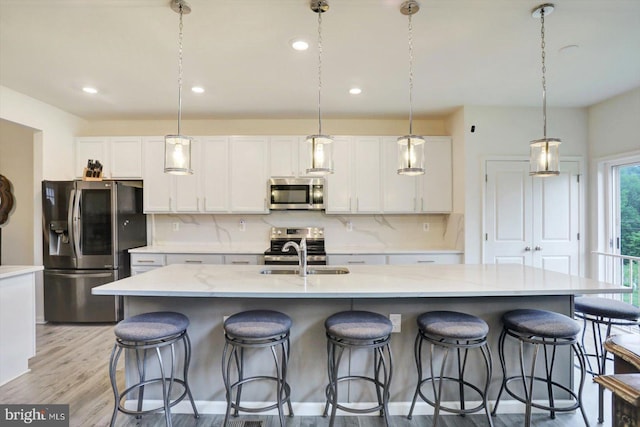 18010 Dave Anne Cir, Stewartstown, PA 17363 - kitchen with appliances with stainless steel finishes, white cabinets, backsplash, a sink, and recessed lighting