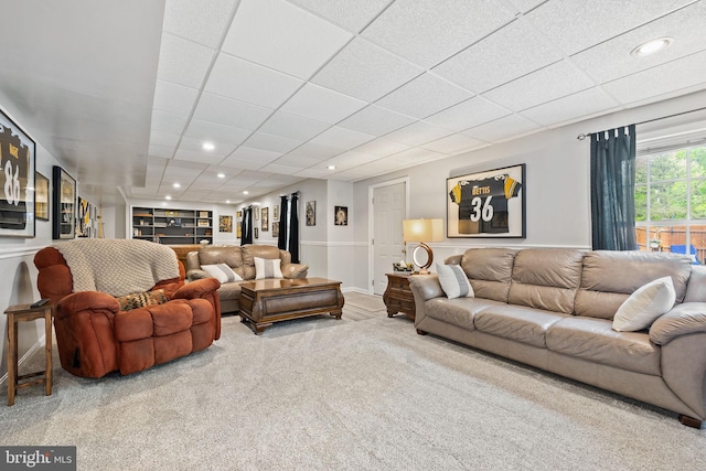 carpeted living area with recessed lighting