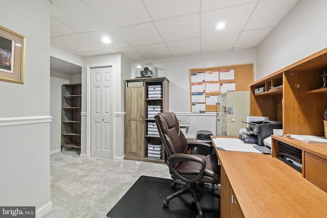 carpeted office space with a paneled ceiling, baseboards, and recessed lighting