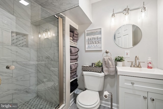full bathroom with vanity, toilet, and a shower stall