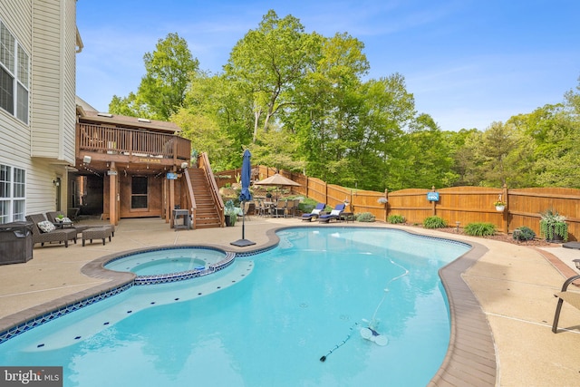 view of pool featuring stairway, a patio, a fenced backyard, and a wooden deck