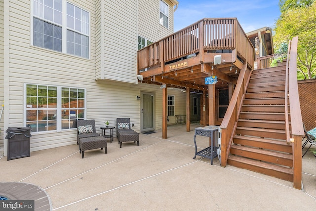 view of patio with stairway and a deck