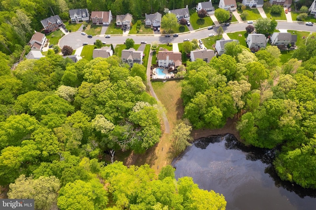 drone / aerial view with a water view and a residential view