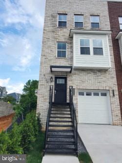 5100 Fitch St SE, Washington, DC 20019 - view of front of home featuring a garage and concrete driveway