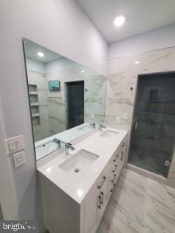 5100 Fitch St SE, Washington, DC 20019 - bathroom with double vanity, marble finish flooring, a stall shower, and recessed lighting
