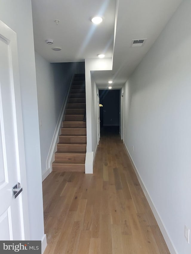 5100 Fitch St SE, Washington, DC 20019 - hall with stairway, light wood-style floors, baseboards, and recessed lighting
