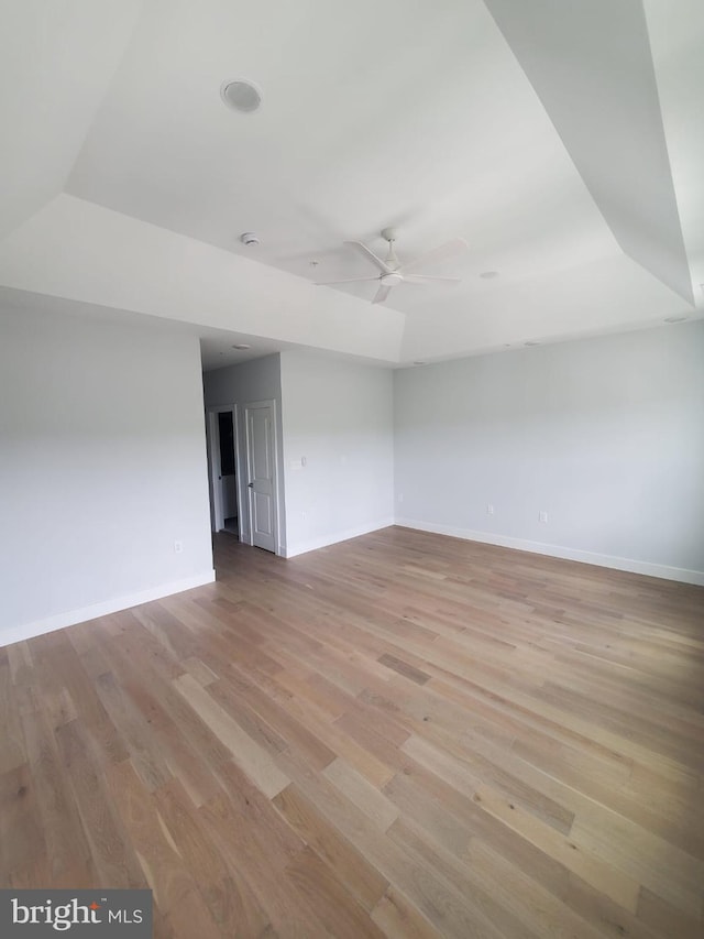 5100 Fitch St SE, Washington, DC 20019 - spare room with baseboards, light wood-style flooring, a ceiling fan, and a smoke detector