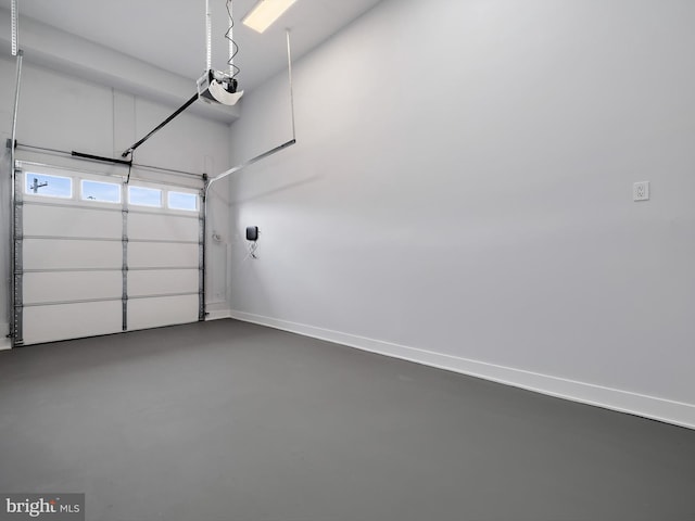 5100 Fitch St SE, Washington, DC 20019 - garage with baseboards and a garage door opener
