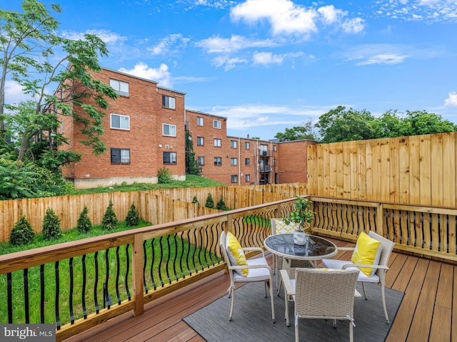 5100 Fitch St SE, Washington, DC 20019 - wooden deck with outdoor dining space and a fenced backyard