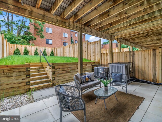 5100 Fitch St SE, Washington, DC 20019 - fenced backyard featuring a patio area and central air condition unit