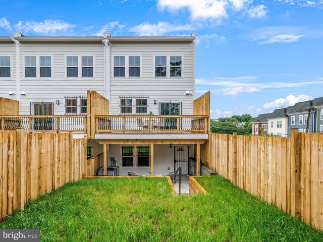5100 Fitch St SE, Washington, DC 20019 - rear view of house with a deck and a patio area