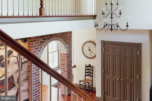 interior space with wood finished floors and a notable chandelier