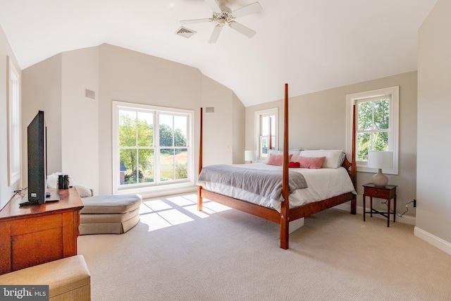 bedroom featuring visible vents, multiple windows, and lofted ceiling