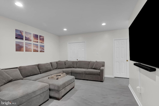 living area with recessed lighting, baseboards, and light carpet