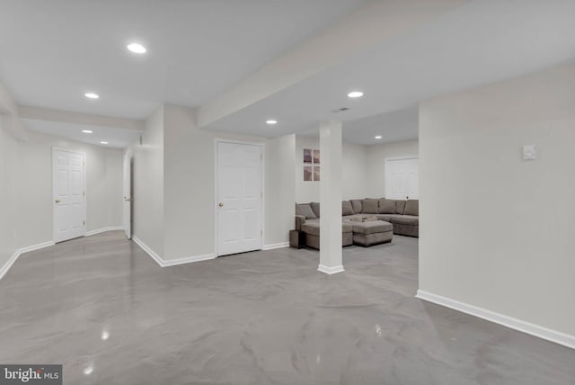 below grade area featuring baseboards and recessed lighting