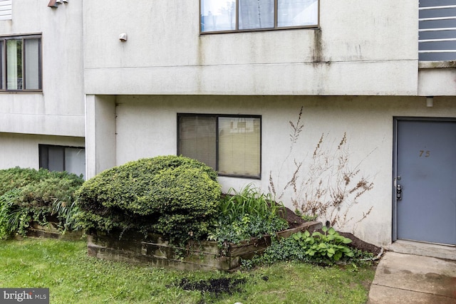 75 Ashlar Hill Ct Unit 75, Baltimore, MD 21234 - doorway to property featuring stucco siding