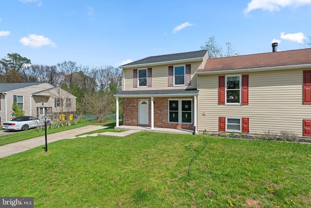 split level home with a front yard