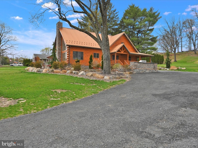 1918 Friedensburg Rd, Reading, PA 19606 - cabin with a front lawn, a chimney, covered porch, and metal roof