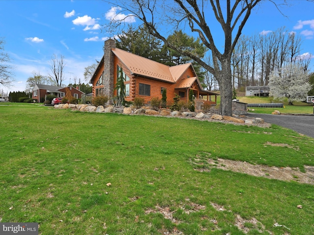 1918 Friedensburg Rd, Reading, PA 19606 - view of property exterior with a yard, log exterior, a chimney, and metal roof