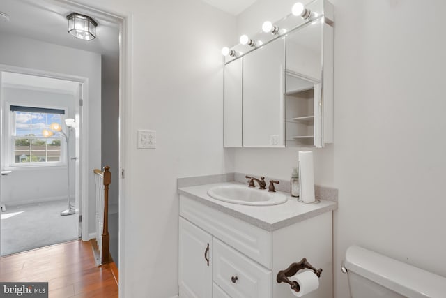 9060 Moonshine Holw Unit G, Laurel, MD 20723 - half bathroom featuring vanity, wood finished floors, and toilet