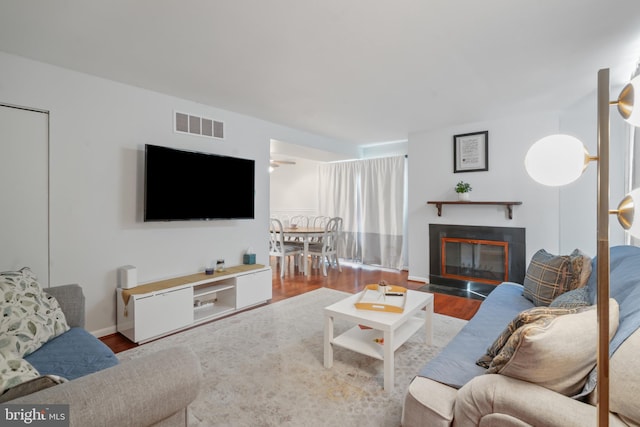 9060 Moonshine Holw Unit G, Laurel, MD 20723 - living area with wood finished floors and a fireplace with flush hearth