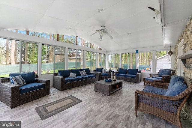 sunroom / solarium with outdoor lounge area and a ceiling fan