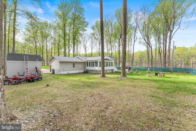 view of yard with a sunroom