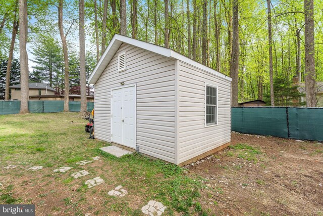 view of outdoor structure with an outdoor structure and fence