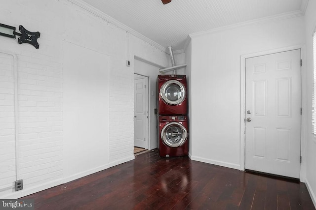 2728 Minnesota Ave SE, Washington, DC 20019 - washroom with crown molding, stacked washer / drying machine, and hardwood / wood-style floors
