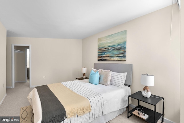 bedroom featuring baseboards and carpet flooring