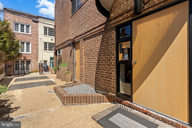 property entrance with brick siding