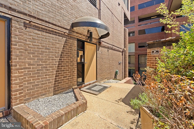 exterior space with brick siding