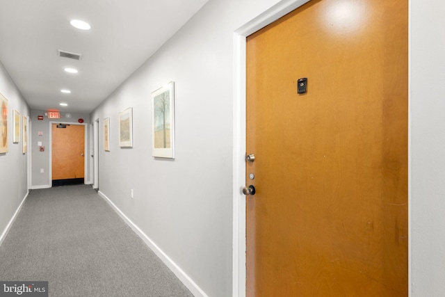 corridor with baseboards, visible vents, carpet floors, and recessed lighting