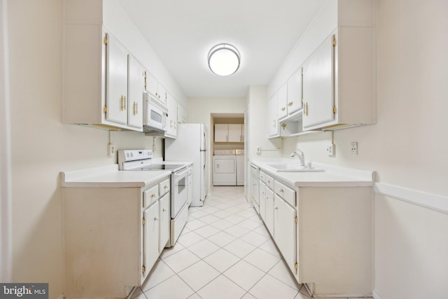 6101 Edsall Rd Unit 1408, Alexandria, VA 22304 - kitchen featuring a sink, light tile patterned floors, light countertops, separate washer and dryer, and white appliances