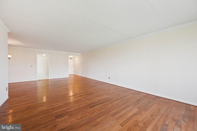 6101 Edsall Rd Unit 1408, Alexandria, VA 22304 - empty room featuring ornamental molding, a textured ceiling, and hardwood / wood-style flooring