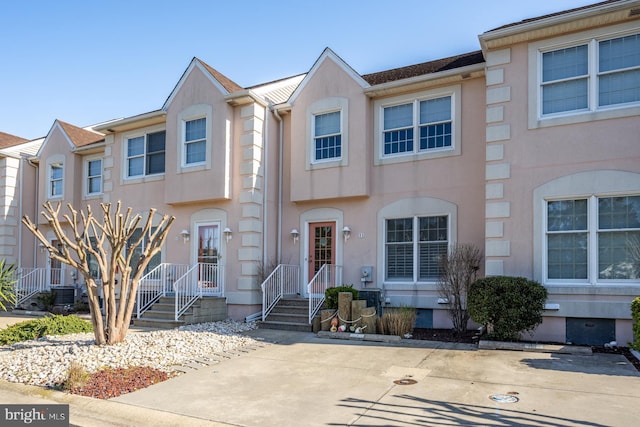13487 Bella Vista Ln Unit 11, Ocean City, MD 21842 - townhome / multi-family property with stucco siding and central AC unit