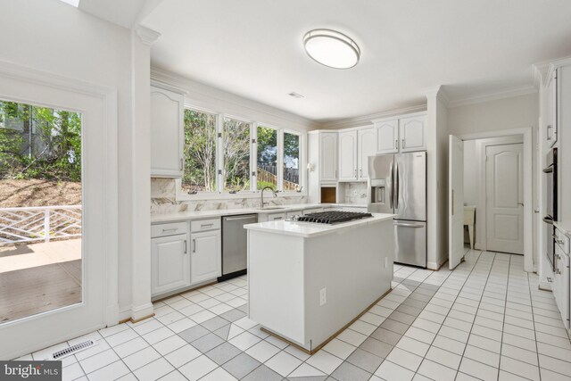 9313 Braymore Cir, Fairfax Station, VA 22039 - kitchen with white cabinetry, appliances with stainless steel finishes, light countertops, and a healthy amount of sunlight