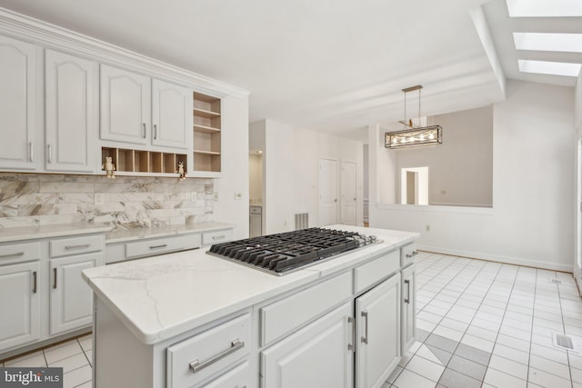 9313 Braymore Cir, Fairfax Station, VA 22039 - kitchen featuring open shelves, a skylight, stainless steel gas cooktop, light tile patterned floors, and backsplash