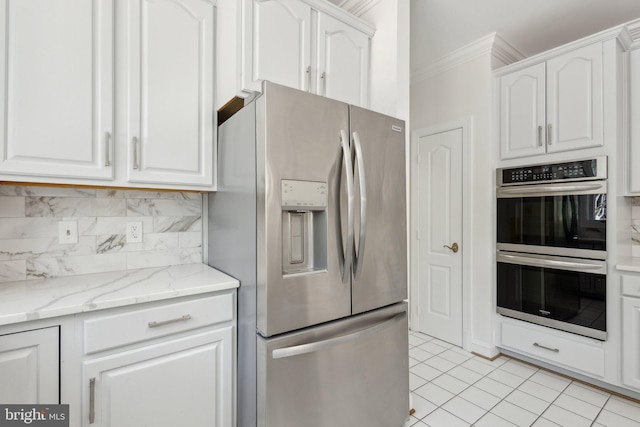 9313 Braymore Cir, Fairfax Station, VA 22039 - kitchen featuring white cabinets, stainless steel appliances, ornamental molding, light tile patterned flooring, and decorative backsplash