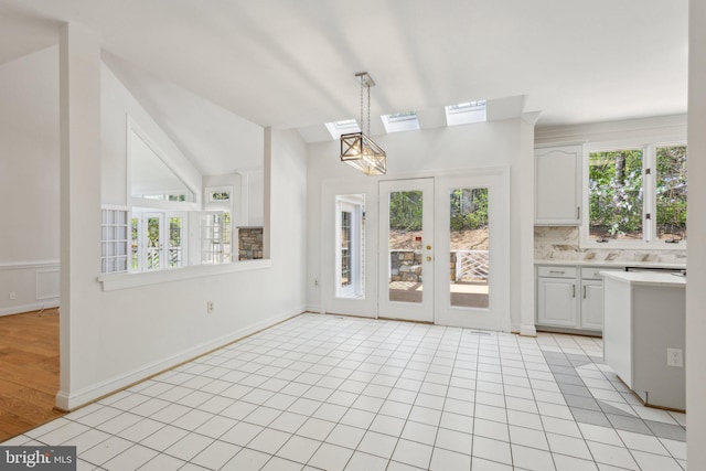 9313 Braymore Cir, Fairfax Station, VA 22039 - unfurnished dining area featuring lofted ceiling with skylight