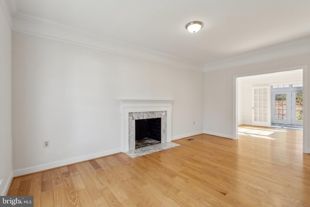 9313 Braymore Cir, Fairfax Station, VA 22039 - unfurnished living room with baseboards, a fireplace, light wood-style floors, and crown molding