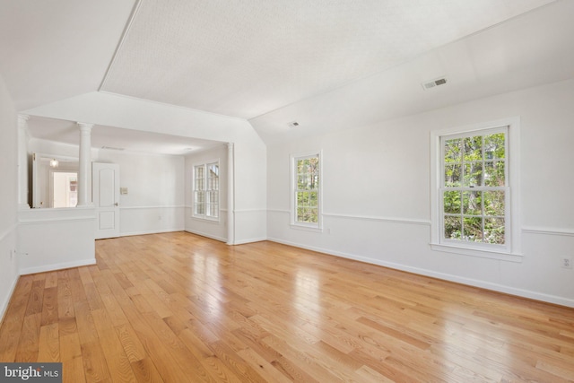 9313 Braymore Cir, Fairfax Station, VA 22039 - empty room featuring light wood-style floors, a healthy amount of sunlight, lofted ceiling, visible vents, and ornate columns