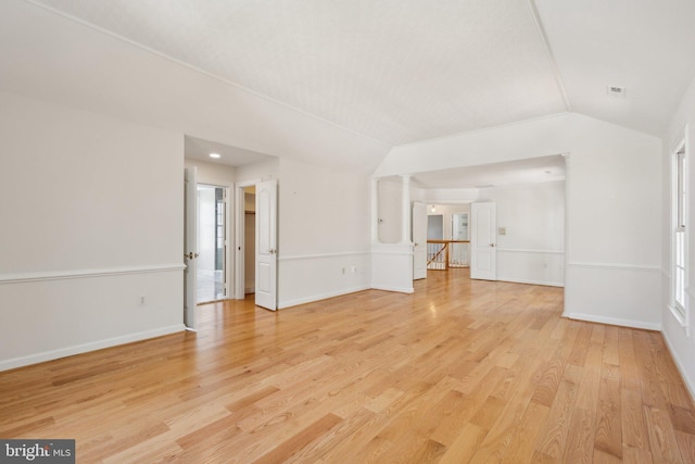 9313 Braymore Cir, Fairfax Station, VA 22039 - unfurnished living room with baseboards, vaulted ceiling, and light wood-style flooring