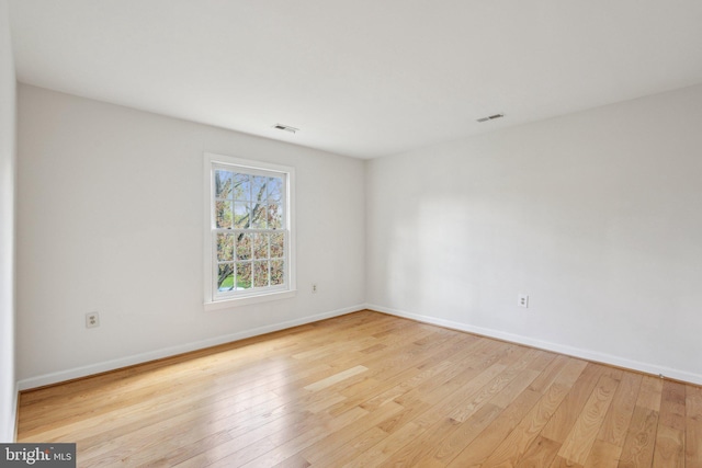 9313 Braymore Cir, Fairfax Station, VA 22039 - spare room with baseboards, hardwood / wood-style floors, and visible vents