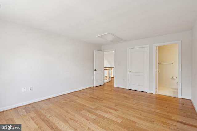 9313 Braymore Cir, Fairfax Station, VA 22039 - unfurnished bedroom with attic access, light wood-style flooring, baseboards, and connected bathroom