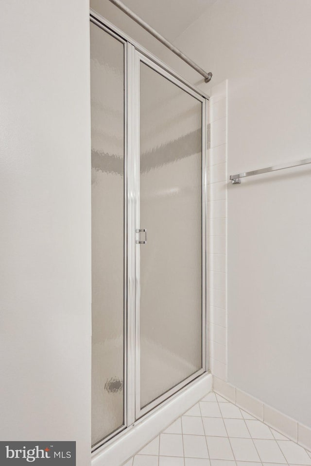 9313 Braymore Cir, Fairfax Station, VA 22039 - bathroom featuring tile patterned floors and a stall shower
